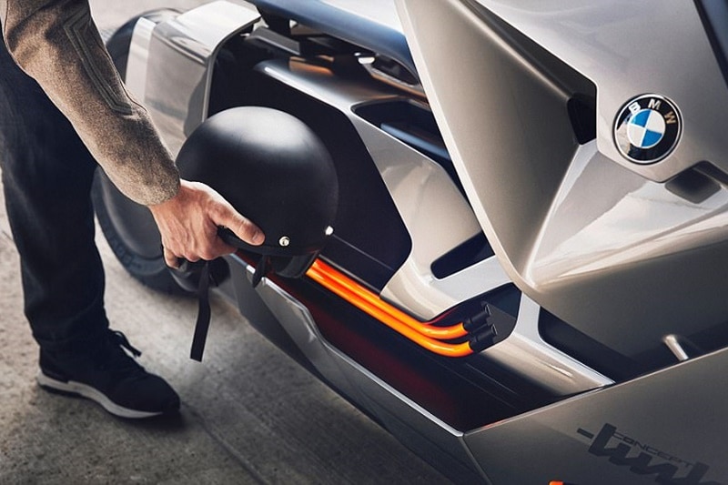 The handlebar gets programmable and touch-enabled buttons to allow the rider to functions without having to lift his arms from the handlebar. Even the rider's equipment will be connected to the scooter. For example, a swipe on the arm of the jacket can open or close the sliding door of the storage compartment. <strong>Also read: <a href="https://www.financialexpress.com/auto/gallery/there-is-no-need-for-a-helmet-or-protective-gear-on-bmw-motorrad-vision-next-100-concept/photos/641355/">There is no need for a helmet or protective gear on BMW Motorrad Vision Next 100 Concept</a></strong>