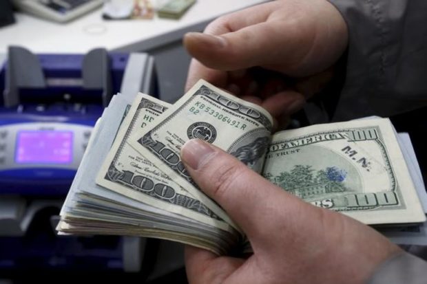 The dollar traded above six-month lows against a basket of six major peers on Friday, having gained some reprieve as solid U.S. economic data helped temper a sell-off triggered by political tumult in Washington. (Reuters) The dollar traded above six-month lows against a basket of six major peers on Friday, having gained some reprieve as solid U.S. economic data helped temper a sell-off triggered by political tumult in Washington. (Reuters)
