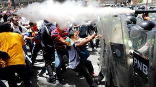 Venezuela, Riot police, military installation, tear gas, water cannon, protest, protesters