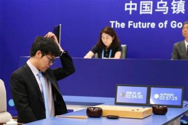 Google’s latest effort to thaw relations with China involves an artificial intelligence pow-wow -- and a game of Go. (Reuters)