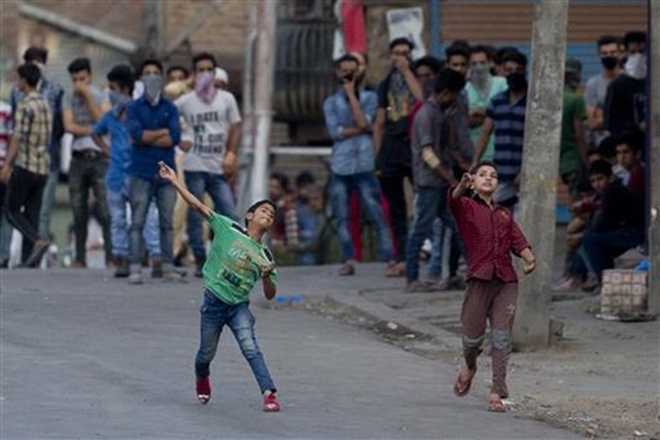 The students were trying to come out of the campus to block traffic on the busy road when police intervened with tear smoke shells to contain them. (PTI) The students were trying to come out of the campus to block traffic on the busy road when police intervened with tear smoke shells to contain them. (PTI)