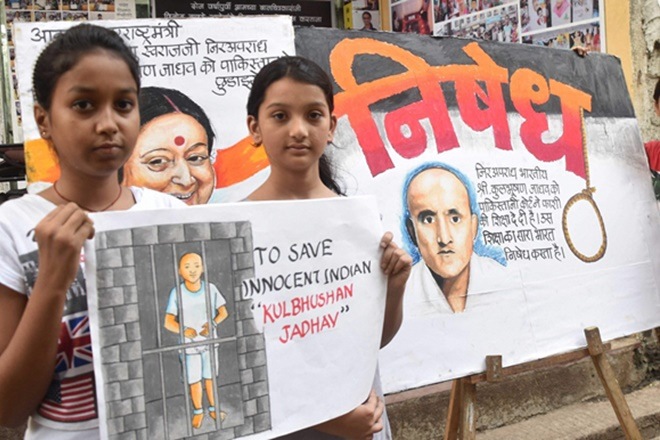 Girls display painting of former Indian naval officer Kulbhushan Jadhav, who has been sentenced to death by a Pakistani military court on charges of 'espionage' in Mumbai. PTI File Photo. Girls display painting of former Indian naval officer Kulbhushan Jadhav, who has been sentenced to death by a Pakistani military court on charges of 'espionage' in Mumbai. PTI File Photo.