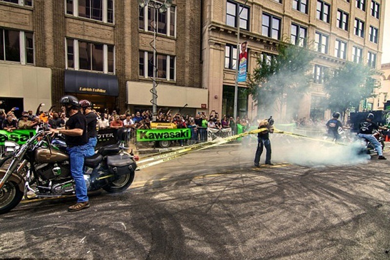 Juli Moody aka 'The Female Human Link'. Are you powerful enough to hold a motorcycle from getting away just by using the strength of your arms? Well, Juli is. She can hold not one, but four Harley Davidson motorcycles down at a time. Juli restrained a Harley for one minute and 4.53 seconds. She holds world records in all three feats of holding down one, two and four motorycles. Juli is also a record holder for having the biggest biceps in female category. (Image: Dailymail)