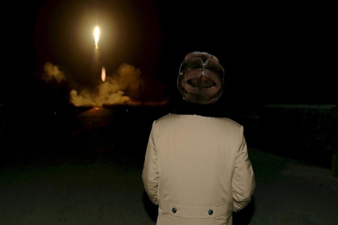 The missile was launched on an unusually high trajectory, with KCNA saying it flew to an altitude of 2,111.5 kilometres and travelled 787 kilometres before coming down in the Sea of Japan (East Sea). (Reuters)