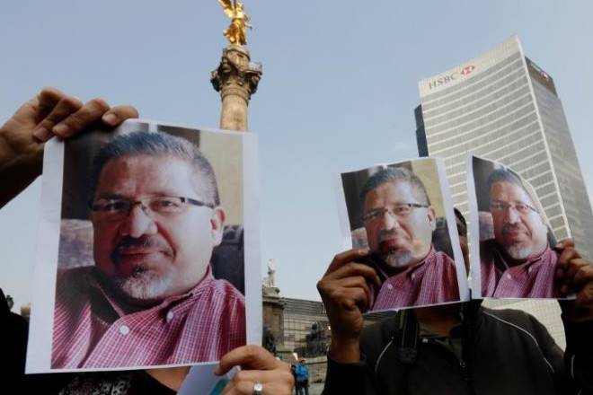 Mexican journalists covered news conferences wearing black on Tuesday, and brought pictures of slain colleagues to rallies to put pressure on authorities to act against an escalation of murderous attacks on their trade. (Reuters) Mexican journalists covered news conferences wearing black on Tuesday, and brought pictures of slain colleagues to rallies to put pressure on authorities to act against an escalation of murderous attacks on their trade. (Reuters)