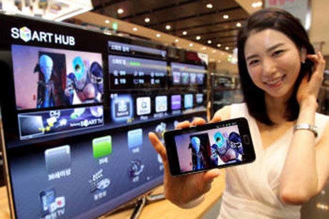 Availability of Smart TVs at par with normal televisions has helped them become one of the preferred mainstream products not just in larger metros but also in smaller towns and tier II cities. (Representative image: AP) Availability of Smart TVs at par with normal televisions has helped them become one of the preferred mainstream products not just in larger metros but also in smaller towns and tier II cities. (Representative image: AP)