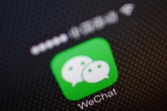 In a cluster of refurbished Mao-era industrial buildings in Guangzhou, developers at China's top messaging app, WeChat, are redesigning key parts of its product to spread its tentacles to just about every aspect of Chinese life. (Reuters)