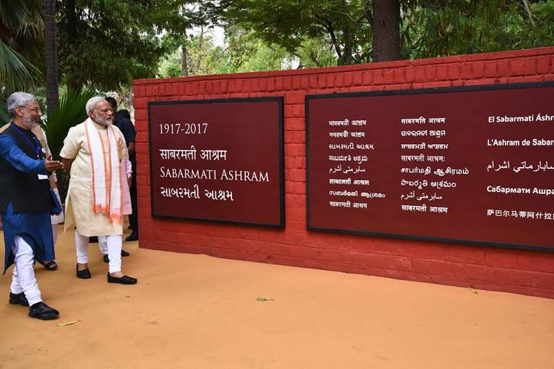 Narendra Modi in Gujarat, Narendra Modi in Gujarat pics, Modi spins charkha, modi spins charkha pics, modi spins charkha images, images of modi spinning charkha, pm modi in Sabarmati Ashram, Sabarmati Ashram, textiles India 2017 Summit, gujarat assembly elections, gujarat assembly polls date, bjp news, gujarat news, ahmedabad, Gandhinagar, bjp, bjp news, modi pics, gujarat pics, sabarmati ashram pics