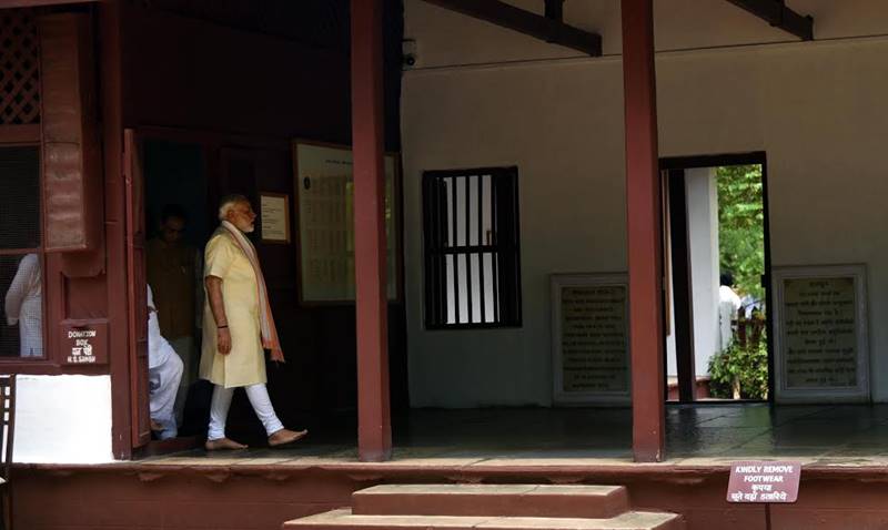Narendra Modi in Gujarat, Narendra Modi in Gujarat pics, Modi spins charkha, modi spins charkha pics, modi spins charkha images, images of modi spinning charkha, pm modi in Sabarmati Ashram, Sabarmati Ashram, textiles India 2017 Summit, gujarat assembly elections, gujarat assembly polls date, bjp news, gujarat news, ahmedabad, Gandhinagar, bjp, bjp news, modi pics, gujarat pics, sabarmati ashram pics