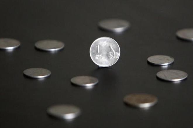 Rupee gains 11 paise against dollar, stocks play anchor Rupee gains 11 paise against dollar, stocks play anchor