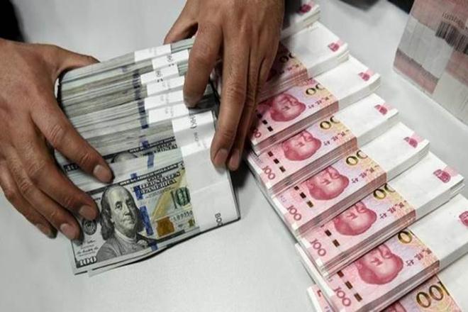 China’s yuan eases on weaker fix, seasonal corporate dollar demand