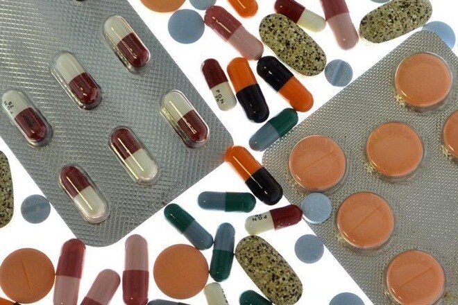 Pharmaceutical tablets and capsules in foil strips are arranged on a table in this picture illustration taken in Ljubljana September 18, 2013. REUTERS/Srdjan Zivulovic/Files