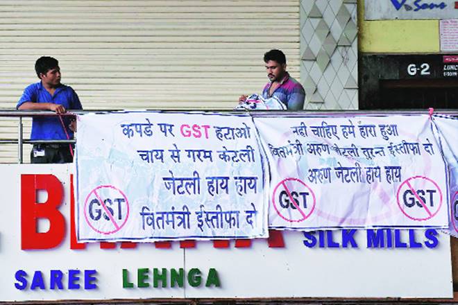 GST rollout, Goods and Services Tax, GST, tax, single tax, transactional value, commission, Clothes, natural fibers, silk sarees, sarees, Gold, GST Council, cigarettes, gst rate, gst rate on cigarettes, gst tax rate, gst rate on clothes