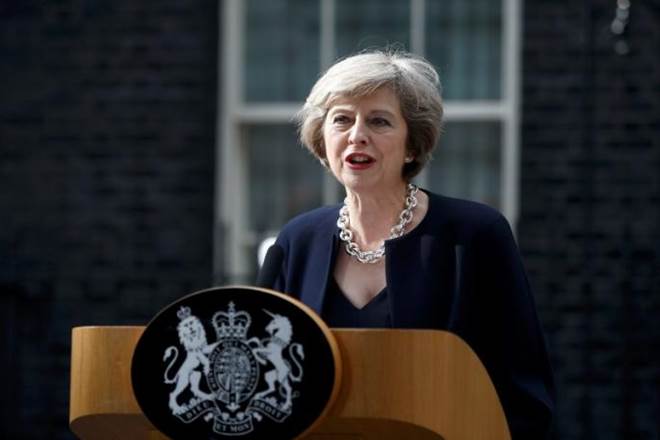 Prime Minister, Theresa May, convince lawmakers, lawmakers, Conservative Party, disastrous gamble, snap election, formal Brexit talks, parliamentary majority
