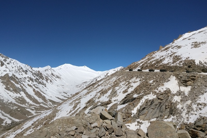 Narrow mountain passes are give way to stunning snow clad peaks interjected with muddy slopes and green valleys. If you are planning the trip in anything other than an SUV, a sump guard is probably a must.