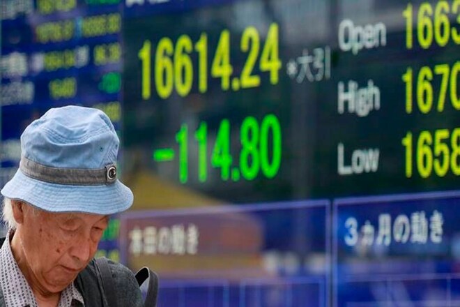 Nikkei slips as stronger yen takes a toll, Takata shares plummet