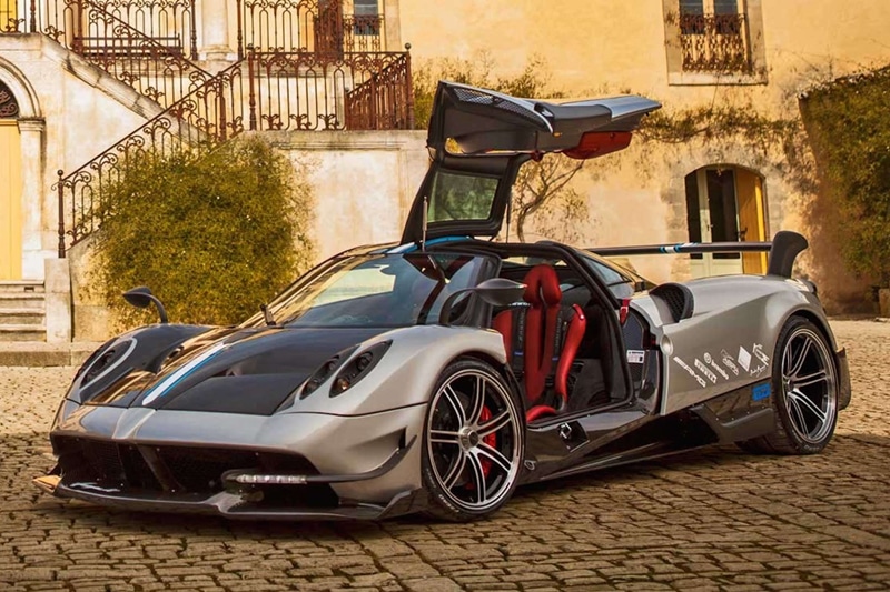 Pagani Huayra BC: If there is one car brand that is known for not just mental performance figures but ostentatious designs, it is Pagani. Horacio Pagani's mentor and very old friend, Benny Caiola, came to the French carmaker with a request for a faster Huayra, for which he extended some of his insights too. The Huayra name is speculated to be borrowed by the Andean god of wind, Huayra-tata and it is powered by a 6.0-litre twin-turbocharged V12 motor that generates roughly 790 hp of power and 1,100 Nm of torque. All the power is sent to the rear wheels via a seven-speed Xtrac single-clutch transmission which shifts the gear in 150 milliseconds in the standard Huayra. In the Huayra BC, an even lighter weight of materials of select panels to increase the power-to-weight ratio and the reduction of transmission change time to 75 milliseconds has made it even faster and mental than the standard hypercar. This is priced only at $2.8 million