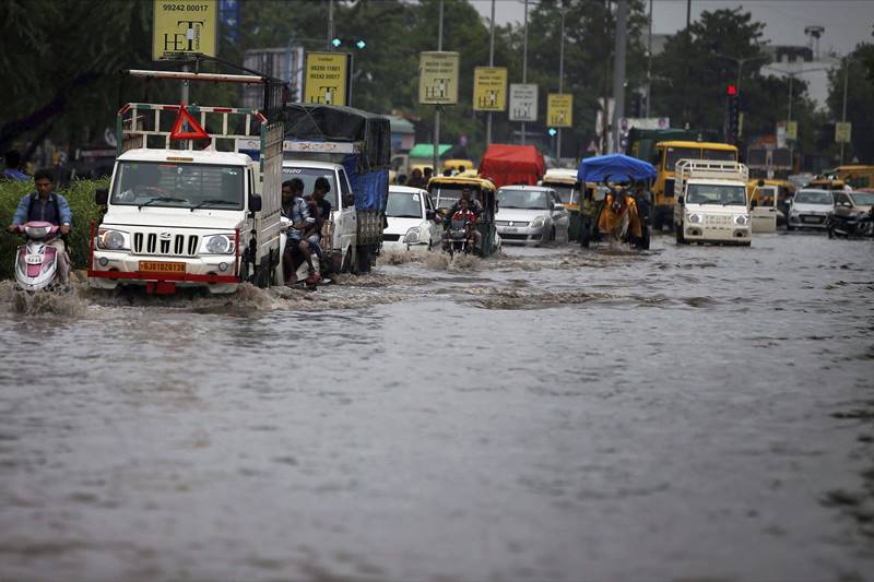 gujarat floods, gujarat rains, monsoon in india, rains in india, flood across india, flood pics, monsoon pics, rajasthan floods, Indian Air Force, latest pics