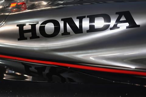 TOKYO, JAPAN - FEBRUARY 10: Honda logo is seen on McLaren-Honda MP4-30 displayed at the press conference at the Honda Motor Co. headquarters on February 10, 2015 in Tokyo, Japan. Honda Motor Co., Ltd. held a press conference in the run-up to the Australian Grand Prix of the FIA Formula One World Championship (F1) happening in March 13-15, 2015. McLaren-Honda drivers Fernando Alonso and Jenson Button expressed their enthusiasm for the first race. (Photo by Chris McGrath/Getty Images for Honda Motor Co.)