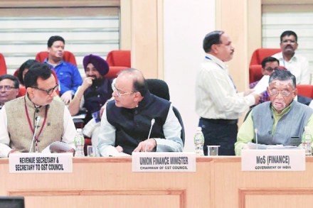 Revenue secretary Hasmukh Adhia, finance minister Arun Jaitley and minister of state for finance Santosh Gangwarat the 18th GST Council Meeting at Vigyan Bhawan in New Delhi on Friday.
