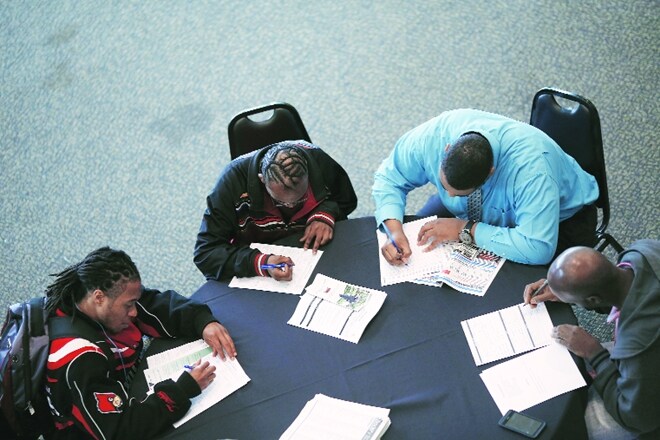 Applicants at a job fair in Kentucky, USA. The book says inequality has increased in the USA over the years, with contributory factors being erosion of minimum wage, decay of unions, competition from low-wage workers, etc. (Bloomberg)