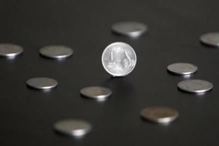 Rupee goes up slightly by 9 paise against dollar