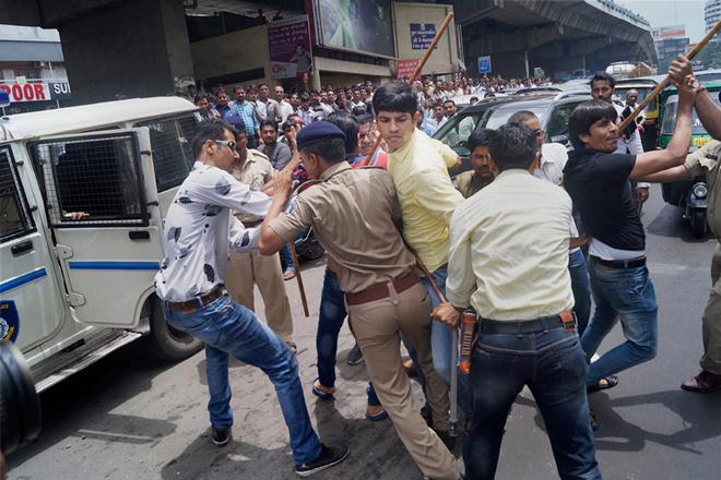 GST, GST news, GST latest news, GST aftermath, GST impact, GST protest continues, surat protest, GST on textiles, textile traders protest