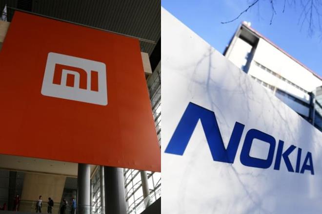 Xiaomi, Nokia, Microsoft Corp, Nokia Oyj, Chinese smartphone maker,  Finnish company, Wang Xiang,  Pinecone smartphone 