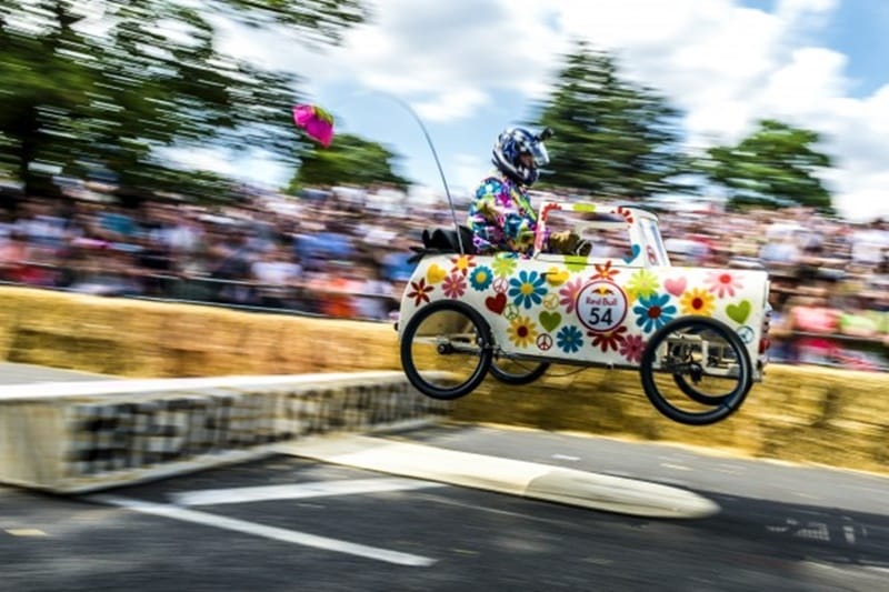 The Alexandra Palace Soap Box car intends to spread the message of peace and love, especially with the peace sign logo at the front.