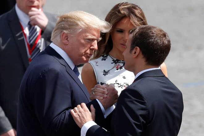 At a G20 summit last weekend, the two had another energetic tug-of-war, while their talks in Paris today finished with a 25-second powergrip in which neither man looked like they wanted to let go. (Reuters)