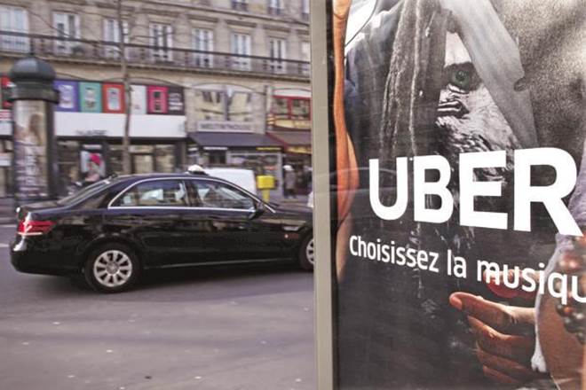 The deal could include an injection of new money into the ride-hailing startup, the people said. (Reuters)