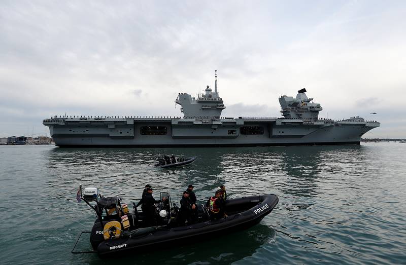 HMS Queen Elizabeth, HMS Queen Elizabeth images, HMS Queen Elizabeth pics, biggest warship, largest warship, Britain Royal Navy, HMS Queen Elizabeth sets sail, Britain largest-ever warship, UK biggest warship, sea trial, Scotland, aircraft carrier