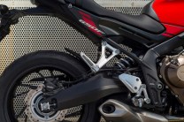 ABS with 320mm dual discs at front and a single 240mm rear disc.