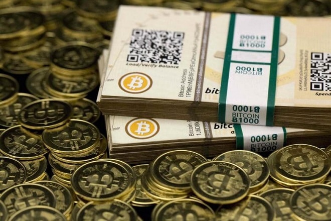 Some of Bitcoin enthusiast Mike Caldwell's coins and paper vouchers, often called "paper wallets", are pictured at his office in this photo illustration in Sandy, Utah, January 31, 2014. Caldwell recommended their use as a way to store Bitcoins offline. REUTERS/Jim Urquhart REUTERS/Jim Urquhart (UNITED STATES - Tags: BUSINESS)