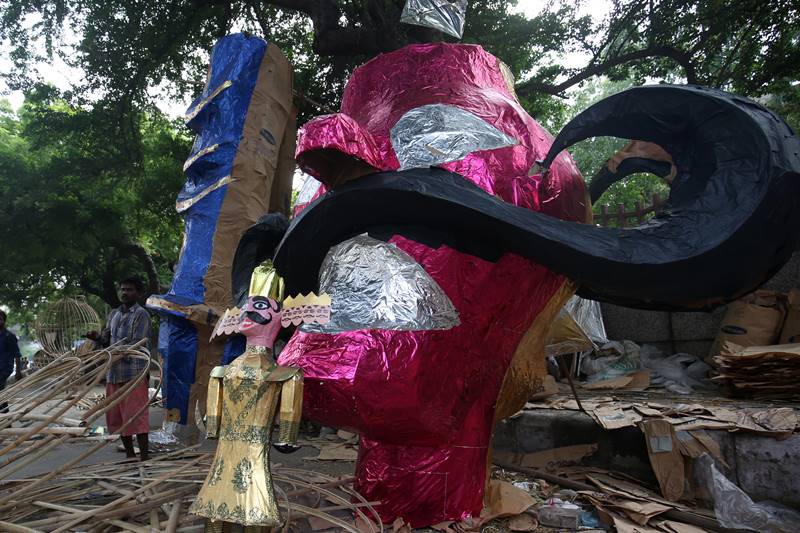 A craftsmen of creating Ravana effigies at Titarpur in West Delhi. (Express Photo By Amit Mehra)
