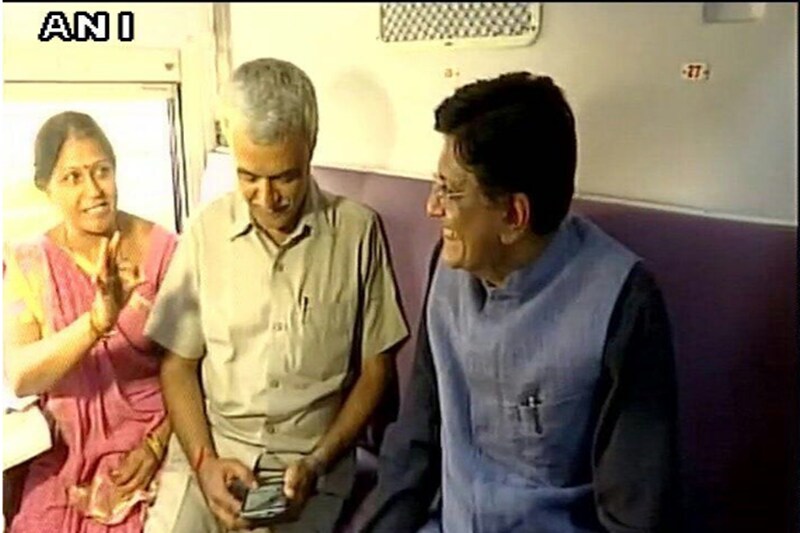The new weekly train consists of 18 coaches- one AC 1st class, two 2nd class AC, eight sleepers, four general, one pantry car and two guard brake vans. There is no AC-3 tier coach. (Railway Minister Piyush Goyal interacts with Mahamana Express train passengers.) (Image: ANI)