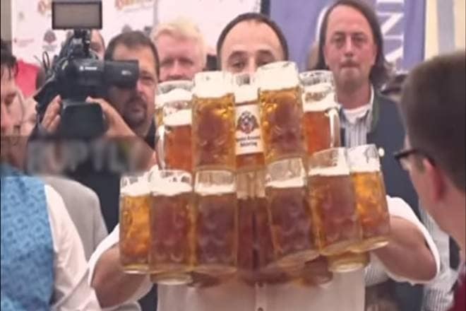 Beer, Germany, man creates record by carrying beer mugs, man breaks previous record Beer, Germany, man creates record by carrying beer mugs, man breaks previous record