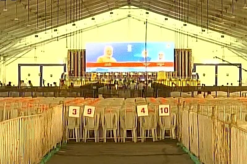 Police officials make sure everything is ready at the hall where Modi will be addressing a public meeting on Sunday. (Source: Twitter/ANI)