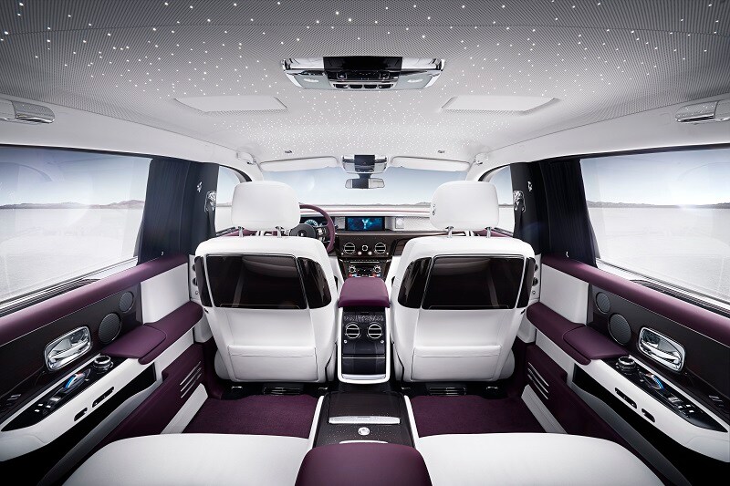 Interiors of the new Rolls-Royce Phantom have a strong horizontal element through the top of the seat, imparting a sense of width, comfort and presence, whilst visually enhanced with a vertical interpretation of the seat ‘bullet’ previously seen in Wraith and Dawn. The new fixed rear centre console receives significant enhancement, by incorporating a drinks cabinet with whisky glasses and decanter, champagne flutes and coolbox.