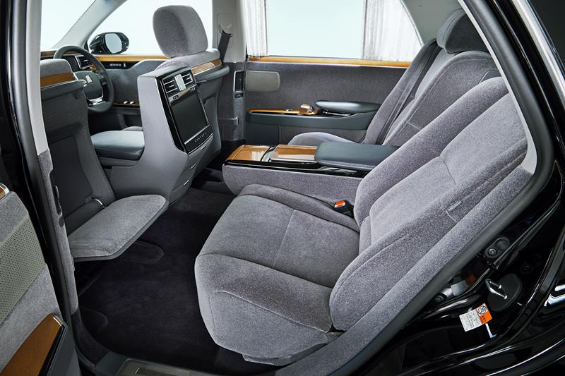 Toyota Century is equipped with furnishings that can be used for either personal or business use like the writing table, reading light, rear seat entertainment system with a large-sized display, and a 20-speaker premium audio system. A raised ceiling gives a sense of space and comfort inside the Toyota Century. Rear-seat features heather-patterned upholstery that is seen on the seats and has been carried out on to the door panel trim, emphasizing horizontal space.