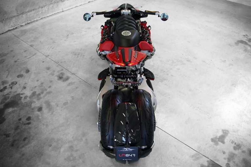 The rear end is a work of engineering genius, a TFX shock connecting both wheels and swingarms transversely, each rear wheel powered with its own chain. The tail section comes from Ducati Panigale which rather seems fitting.