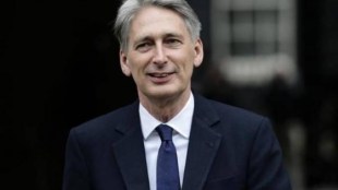 Philip Hammond, pressure on budget, promises for more homes, Theresa May, public finances, London, United Kingdom