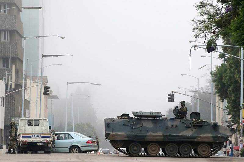 Zimbabwe, Zimbabwe military, Zimbabwe military coup, Zimbabwe crisis, Zimbabwe army, President Robert Mugabe, President mugabe, Zimbabwe under military, Major General Sibusiso Moyo, house arrest, Robert Mugabe house arrest, independence, Britain, world news