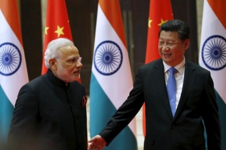 Chinese President Xi Jinping (R) guides Indian Prime Minister Narendra Modi to a meeting room in Xian, Shaanxi province, China, May 14, 2015. REUTERS/Kim Kyung-Hoon Chinese President Xi Jinping (R) guides Indian Prime Minister Narendra Modi to a meeting room in Xian, Shaanxi province, China, May 14, 2015. REUTERS/Kim Kyung-Hoon