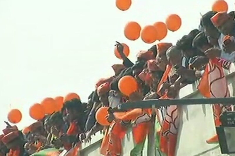 People await PM Modi's arrival, he will be travelling from Sabarmati River in Ahmedabad to Dharoi Dam, via sea plane. (ANI)
