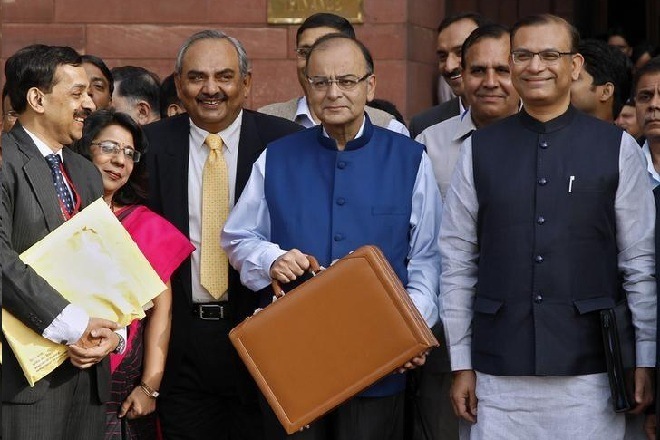 India's Finance Minister Arun Jaitley (C) poses as he leaves his office to present the 2015/16 federal budget in New Delhi February 28, 2015. REUTERS/Vijay Mathur/Files