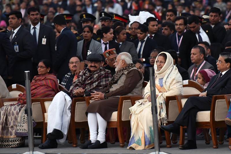 Dressed in brown kurta, white pyjama with a printed shawl thrown over a bundi, the Prime Minister was seen tapping his feet and knuckles during the course of the performances. (Image: Twitter/Narendra Modi)