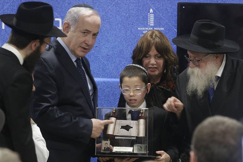 Moshe, who received a memento from Netanyahu, in his short address invited the Israeli prime minister for his `Bar Mitzvah' (a coming-of-age ritual which Jewish boys undergo when they turn 13). (AP Photo)