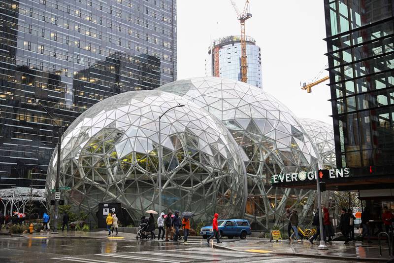 Amazon.com Inc opened a rainforest-like office space in Seattle that it hopes will spark new ideas for employees. While cities across North America are seeking to host Seattle-based Amazon's second headquarters, the world's largest online retailer is still expanding its main campus. Company office towers and high-end eateries have taken the place of warehouses and parking lots in Seattle's South Lake Union district. The Spheres complex, officially open to workers on Tuesday, is the pinnacle of a decade of development here. (Image: Reuters)