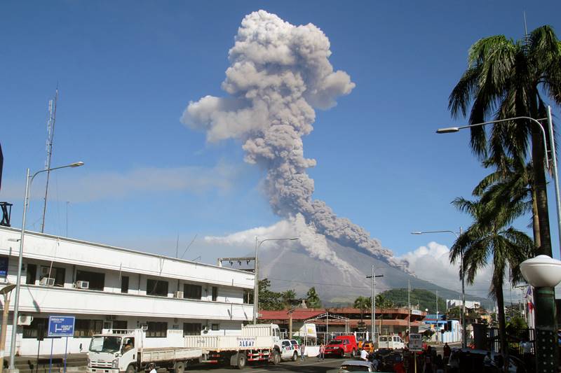 The Philippines' most active volcano ejected a huge column of lava fragments, ash and smoke in a thunderous explosion Monday, sending thousands of villagers back to evacuation centers and prompting a warning that a violent eruption may be imminent. The midday explosion sent superheated lava, molten rocks and steam between 3.5 to 5 kilometers (2 to 3 miles) into the blue sky, and then some cascaded down Mount Mayon's slopes and shrouded nearby villages in darkness, Renato Solidum of the Philippine Institute of Seismology and Volcanology and other officials said. (Image: Reuters)